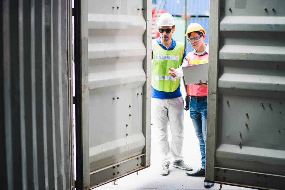 Men looking at a storage unit