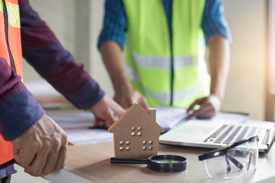 Home Inspectors Discussing A Job